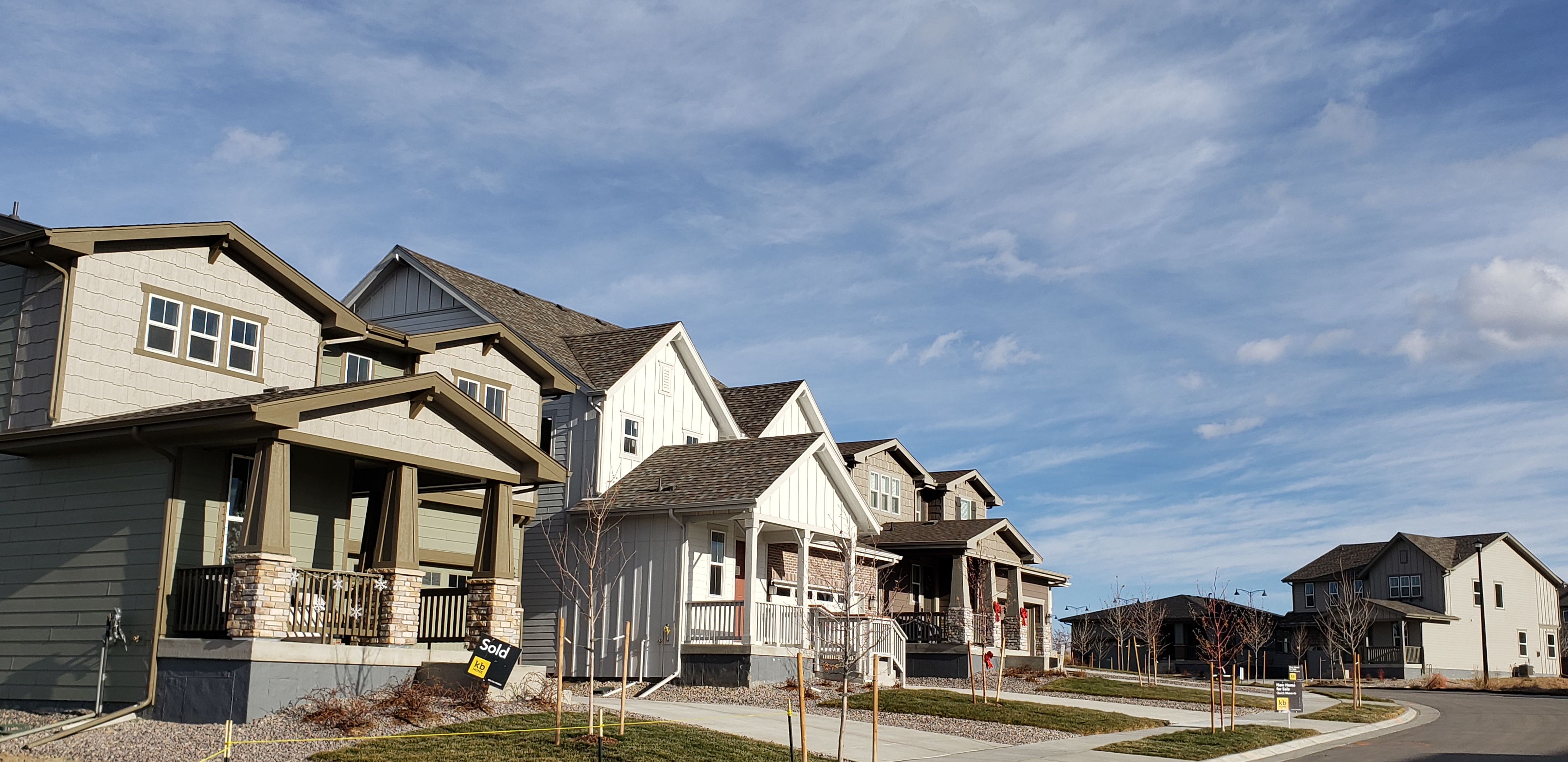 The facade of 3 homes in Prairie Center Village I 