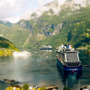 Photograph of several boats on a Scandanavian Fjord. 